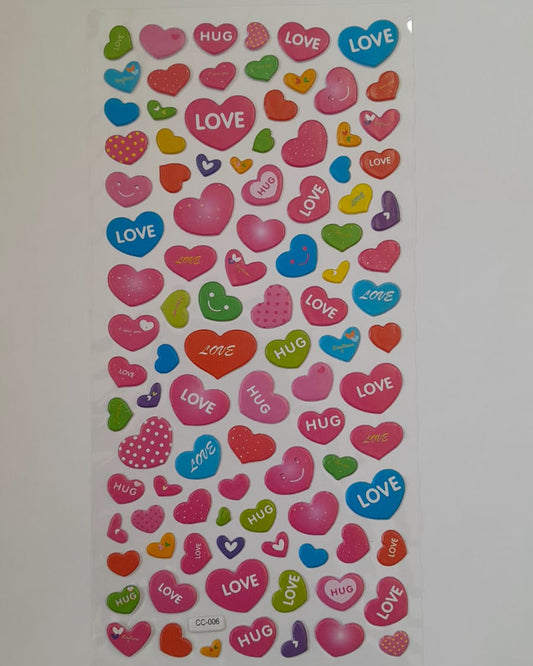 Sheet of colorful heart-shaped stickers with 'LOVE' and 'HUG' text on a white background